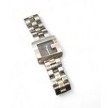 A Gucci lady's stainless steel wristwatch, model no. 3600J, quartz movment,  black dial, the bezel