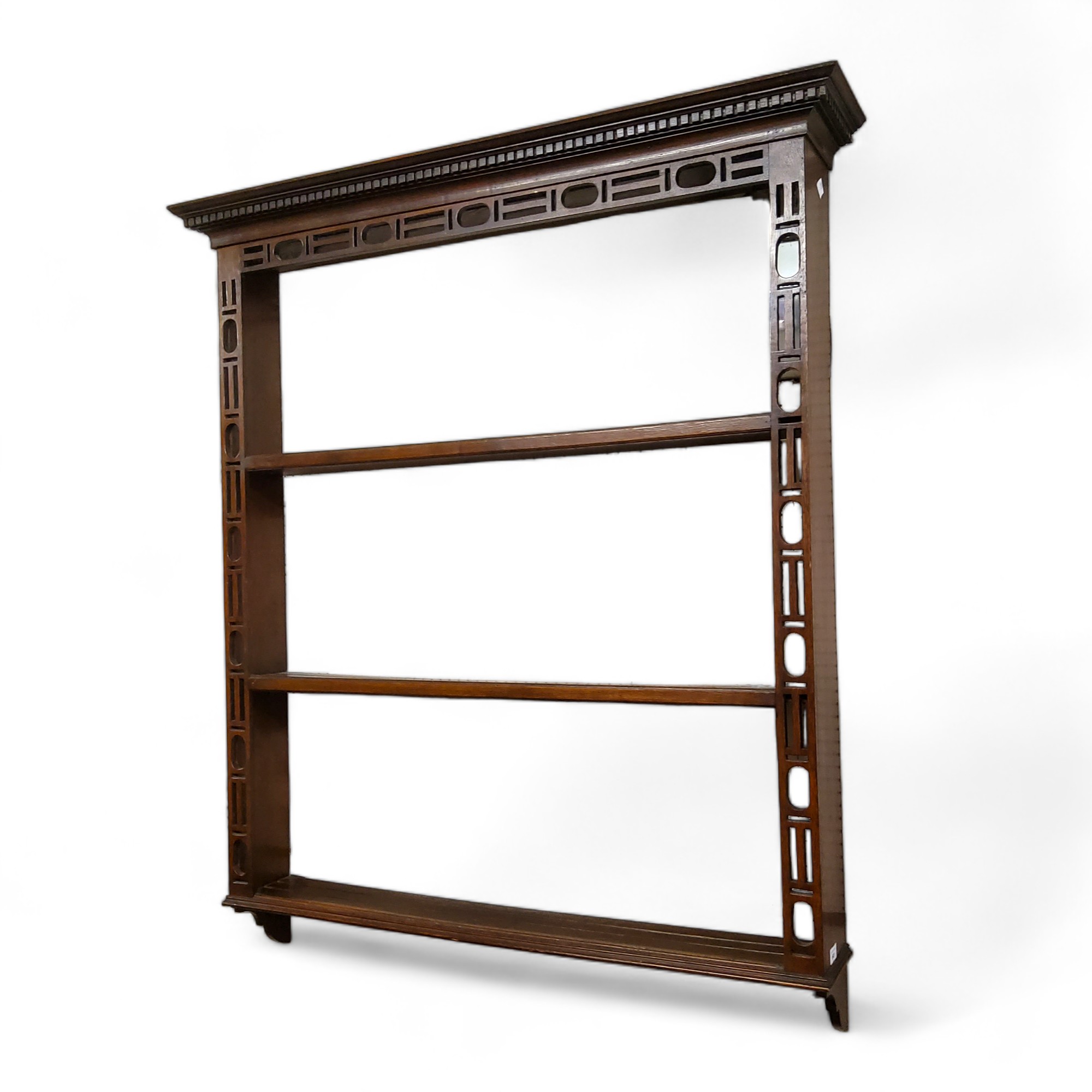 A Chinese Chippendale Revival oak open plate rack, dental cornice, 136cm high, 110cm wide