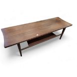 A Mid 20th century teak coffee table, with lower tier, tapered legs.