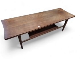 A Mid 20th century teak coffee table, with lower tier, tapered legs.