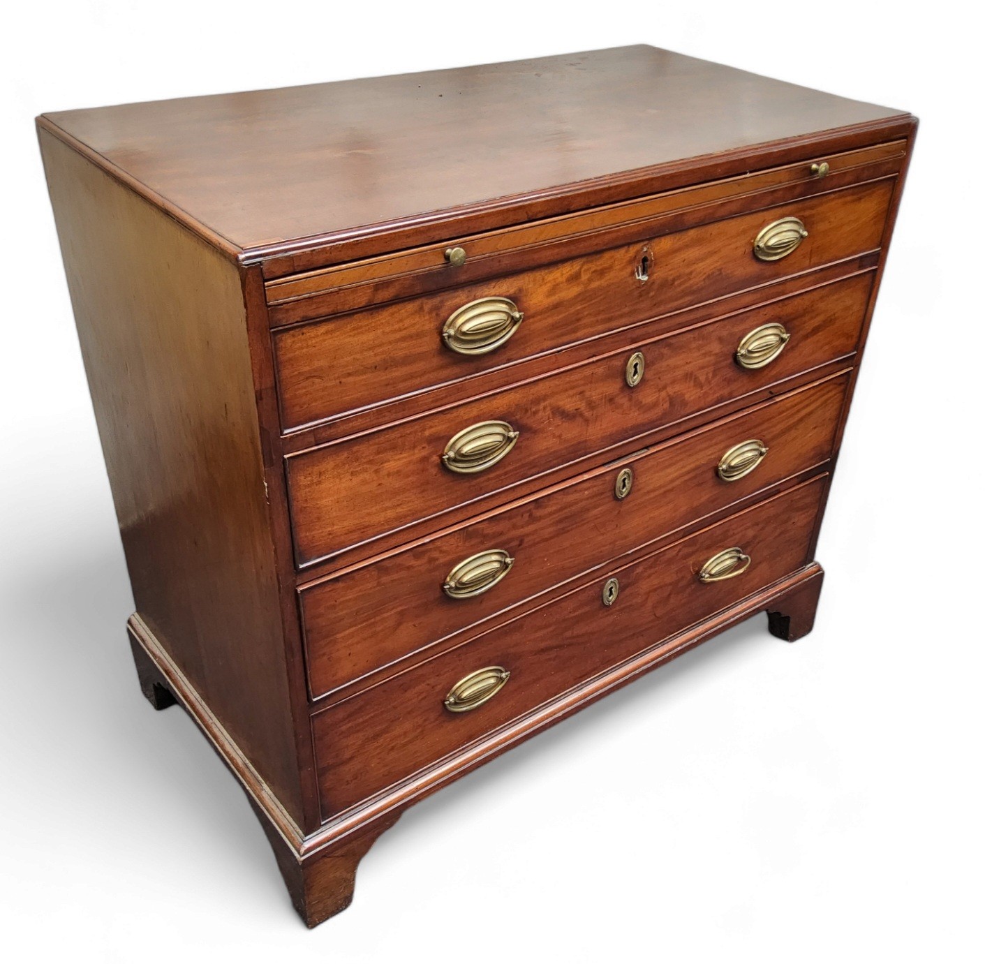 A George III mahogany caddy top bachelors chest, crossbanded top with moulded edge above a slide