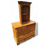 A pine chest of two short and two long drawers, swing handles, bracket feet, 91cm x 48cm; a small