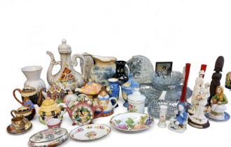 Novelty teapots;  glass bowls;  a pair of red specimen vases; decorative figures;  etc
