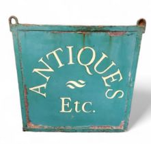 A cast iron shop sign, Antiques Etc., 63cm wide