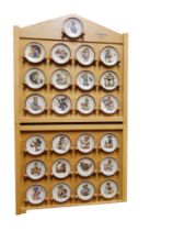 A set of twenty five Goebel miniature plates, designed by M I Hummel, 8cm high, printed marks,