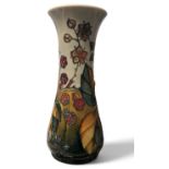 A contemporary Moorcroft Bramble pattern slender baluster vase, tube lined with berries and