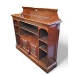 A late 19th century mahogany bookcase, fluted to frieze, plinth base, 128cm high, 130cm wide, c.1870