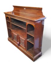 A late 19th century mahogany bookcase, fluted to frieze, plinth base, 128cm high, 130cm wide, c.1870