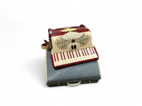 An Italian Sonola 120 bass accordion, with two choir, 72 buttons, in red, cased