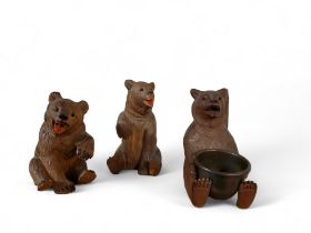 An early 20th century Black Forest table vesta, the bears seated, with brass dish, dished brass