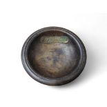 An early 20th century circular pin dish, with plaque, From the teak of H.M.S. Valiant, Jutland 1916,
