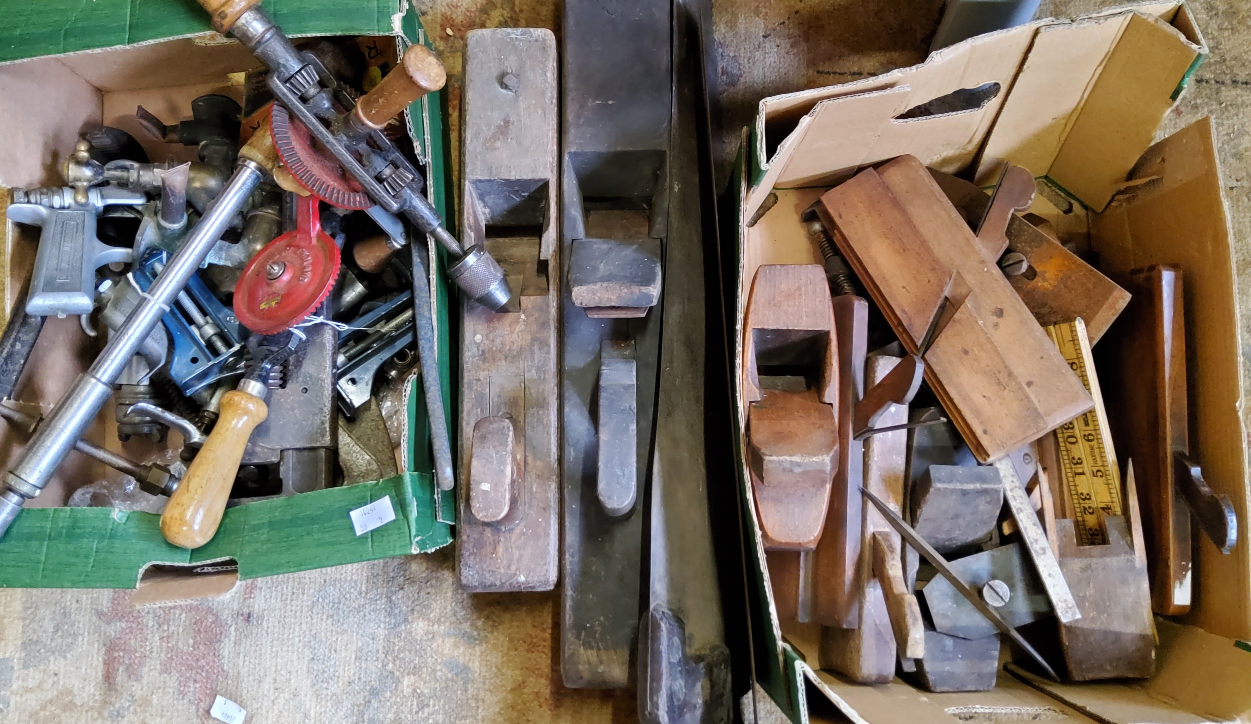 Tools - saws, planes, clamps;  hand drills;  a Harper mincer;  a large wooden bobbin;  an Industrial