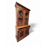 A late 19th century mahogany bookcase, glazed top over single drawer and two doors, (drawer not