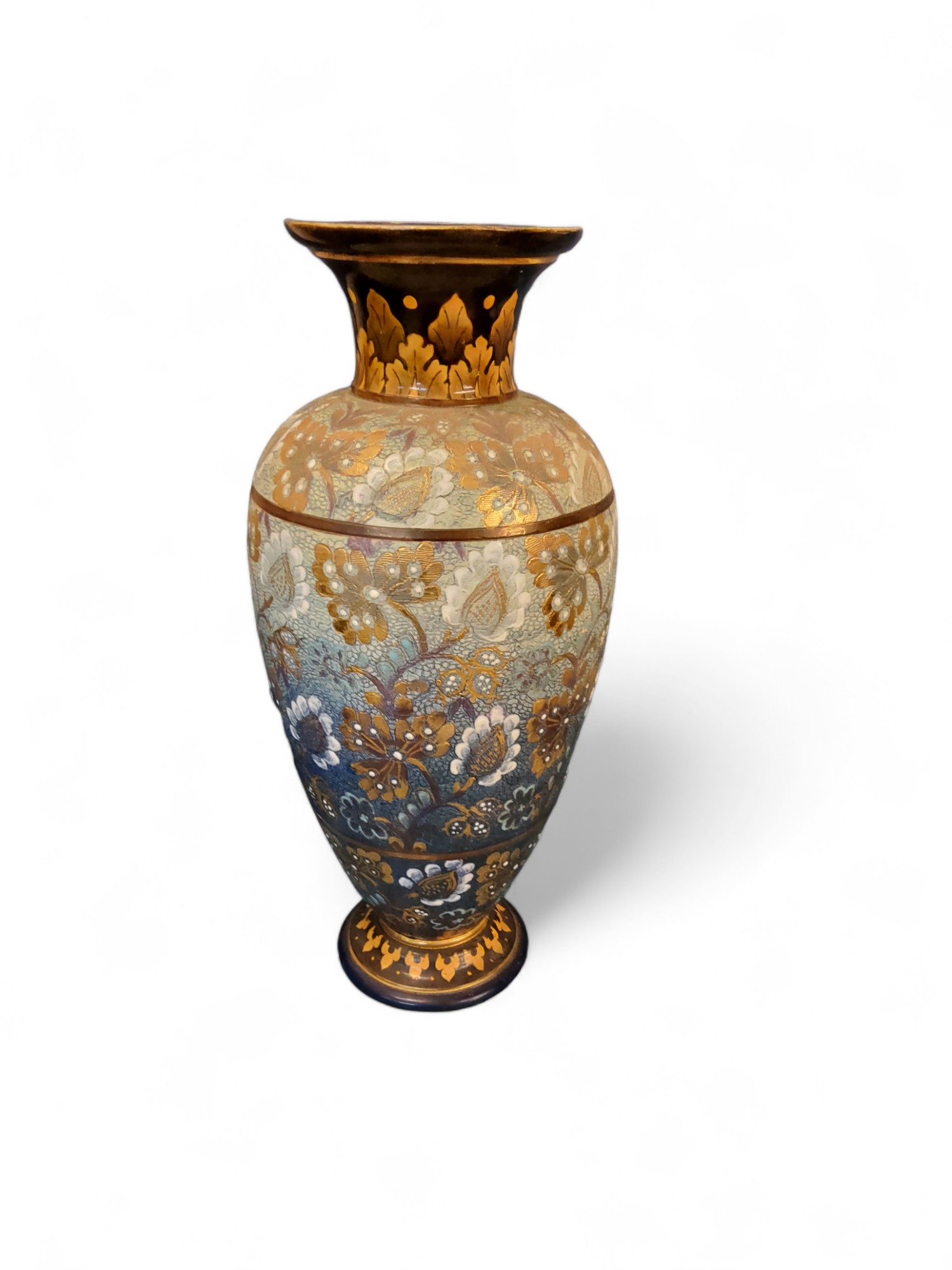 A Doulton Lambeth chine ovoid vase, decorated with flowers in white and gilt on a shagreen ground,