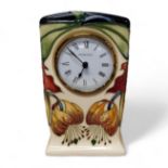 A contemporary Moorcroft Anna Lily clock, designed by Nicola Slaney, tubed lined with stylised