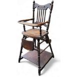 A late 19th century oak high chair, spindle back, turned legs, pad feet.