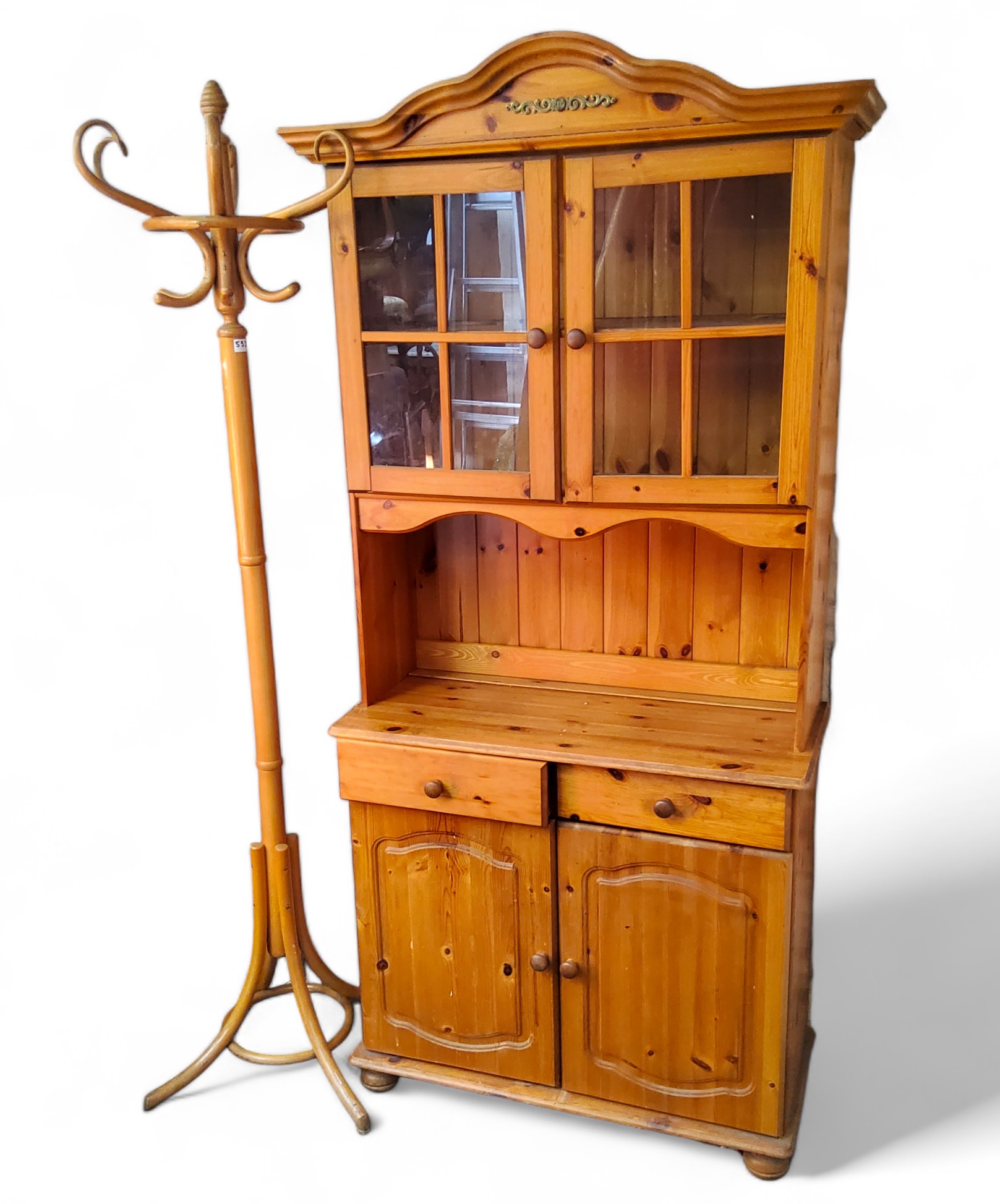 A 20th century pine kitchen dresser, two door display cabinet, open shelf above two drawers and