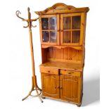 A 20th century pine kitchen dresser, two door display cabinet, open shelf above two drawers and