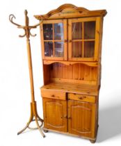 A 20th century pine kitchen dresser, two door display cabinet, open shelf above two drawers and