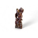 A Japanese padouk figure of a fisherman and child, 36cm high, Meiji period