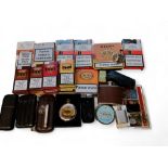 A Zippo Venetian slim brass lighter; a leather three cigar holder; others; various unopened