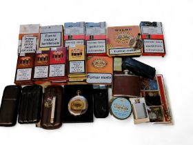 A Zippo Venetian slim brass lighter; a leather three cigar holder; others; various unopened