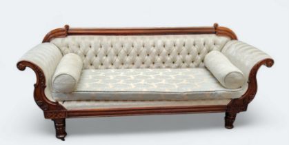 A Victorian mahogany scroll end sofa, upholstered in cream, turned legs. caster feet
