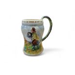 A Crown Devon Musical waisted cylindrical mug, On Ilkla Moor Baht'At, moulded in relief, 17.5cm