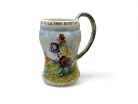 A Crown Devon Musical waisted cylindrical mug, On Ilkla Moor Baht'At, moulded in relief, 17.5cm