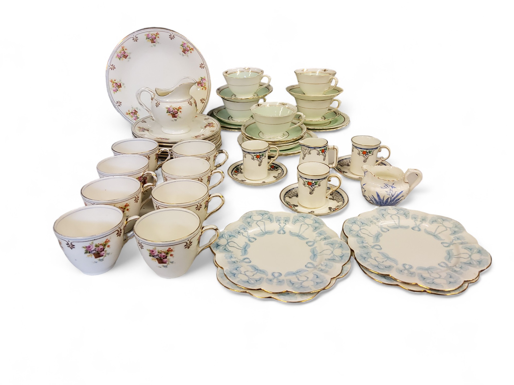 A Royal Doulton part tea service, comprising eight cups, eight plates, two bread and butter