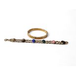 A  bracelet, set with six scarab stones, 19cm long;  a gilt metal bangle (2)