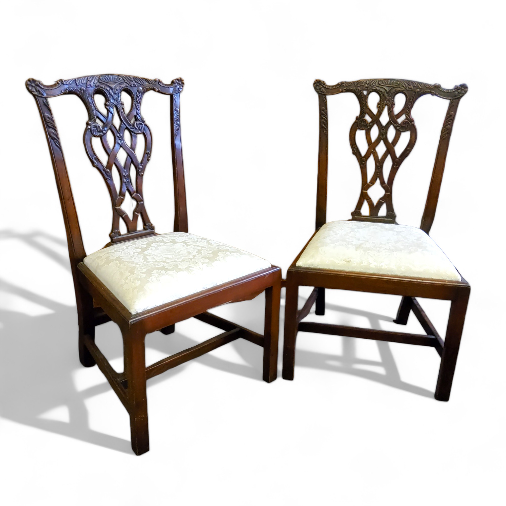 A pair of Chippendale Revival open hall chairs, profusely carved pierced splat, drop in seat, H-
