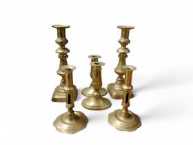 A  George II/George III brass alloy socket candlesticks,  petalled bases, side ejector, 17cm high,