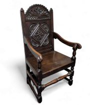 A 17th century style English oak wainscote chair,