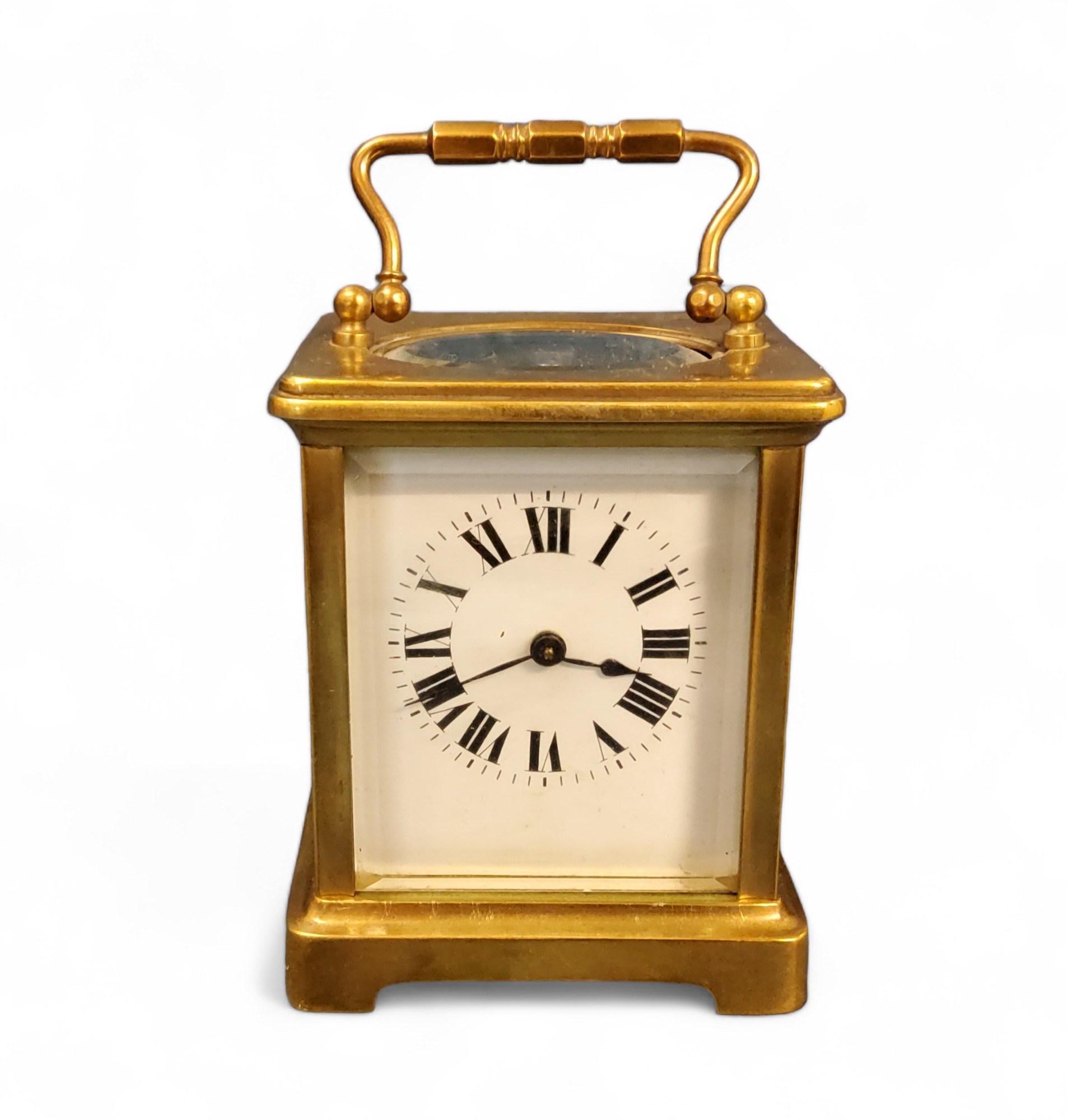 A 20th century brass carriage clock, Roman numerals, swing handle, 10cm high