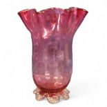 A Victorian cranberry glass vase, flared undulating rim, clear printee feet, 17.5cm high, c.1880