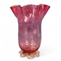 A Victorian cranberry glass vase, flared undulating rim, clear printee feet, 17.5cm high, c.1880
