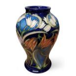 A Moorcroft Loch Hope pattern baluster vases, designed by Philip Gibson, tube lined with snowdrops