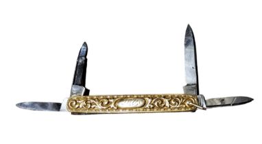 A 19th century gold coloured metal multi-tool pen knife, chased with scrolling foliage,