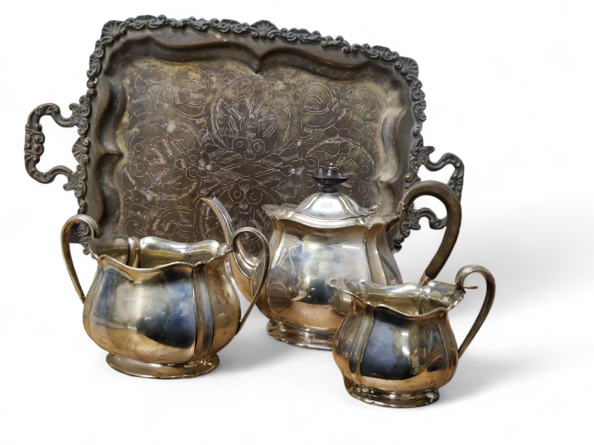 A Maple and Co three piece  plated tea service;  a two handled shaped rectangular tray, 50cm wide