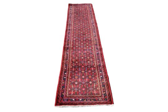 A 19th century Afghan runner, 335cm x 76cm