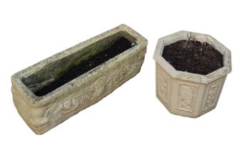 A reconstituted stone rectangular planter/trough, decorated with masks; an octagonal planter,