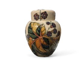 A contemporary Moorcroft Bramble pattern ginger jar and cover, tube lined with berries and leaves,