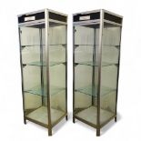 Two tall metal and glass display cabinets, 191cm high x 60cm wide x 62cm deep  Please Note: