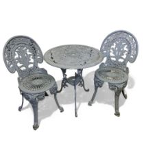 An outdoor cast metal bistro table and chairs for two