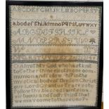 A late 19th century needlework sampler, embroidered with alphabet and verse, 32cm x 27cm, framed