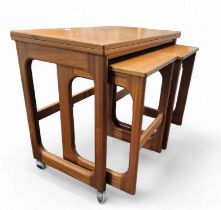 Mid-century Design - a retro McIntosh Tristor teak nest of tables, hinged top above a graduated pair