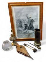 An early 20th century brass fireside set;  bellows;  oil lamp; Lord Baden Powell, monochrome