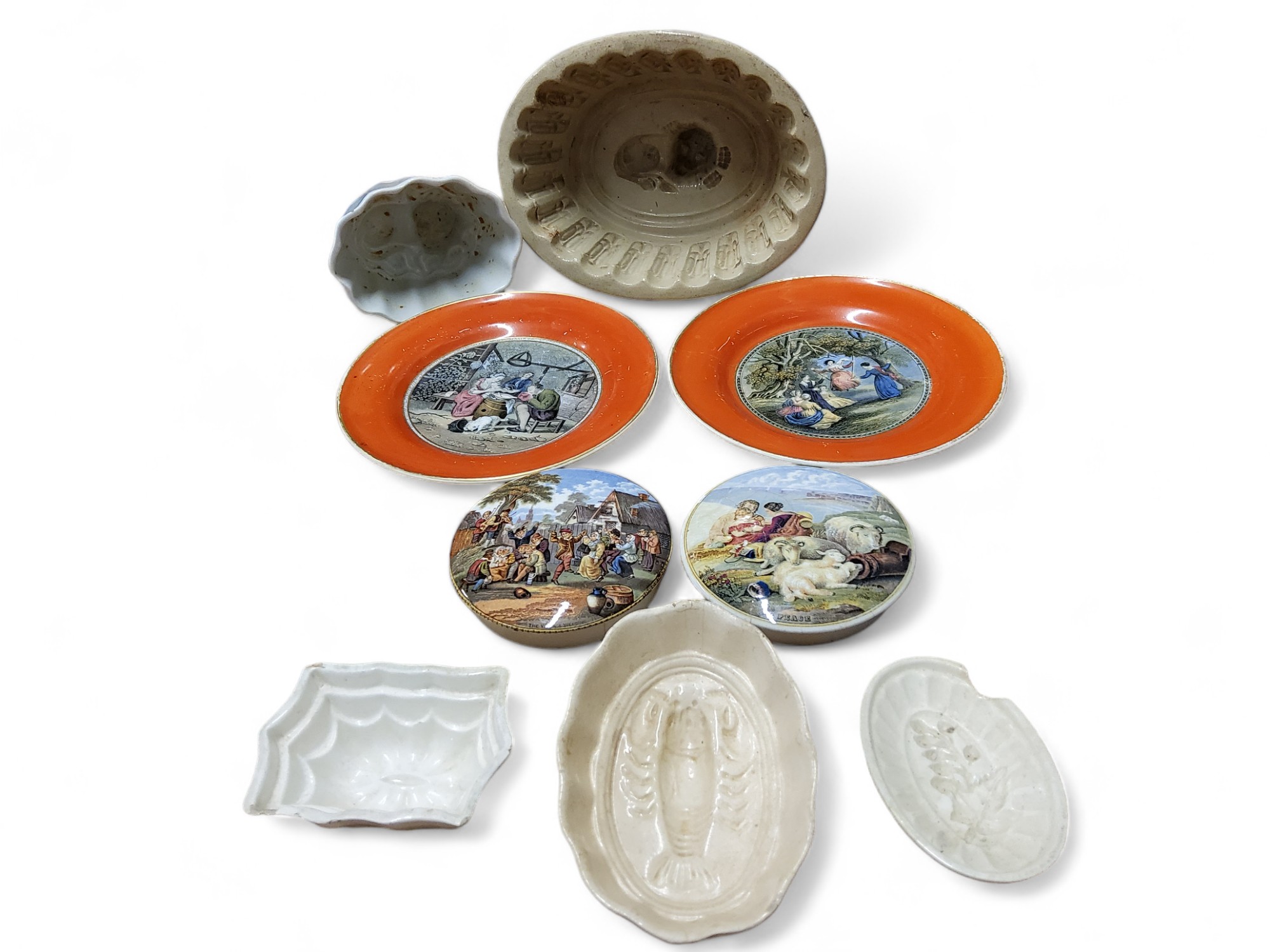 An early 20th century salt glazed stoneware jelly mould, with lion, 20cm wide;  others,