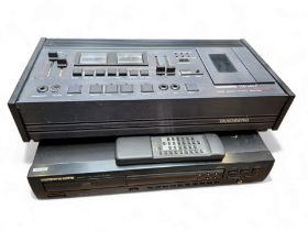 A Tandberg TCD 440 A tape recorder; a Marantz compact disk player CD-63SE with remote.